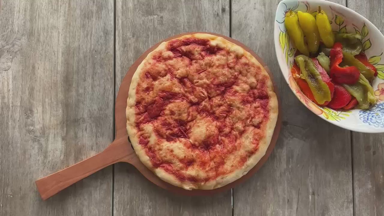 Cargar video: Preparación de la pizza argentina